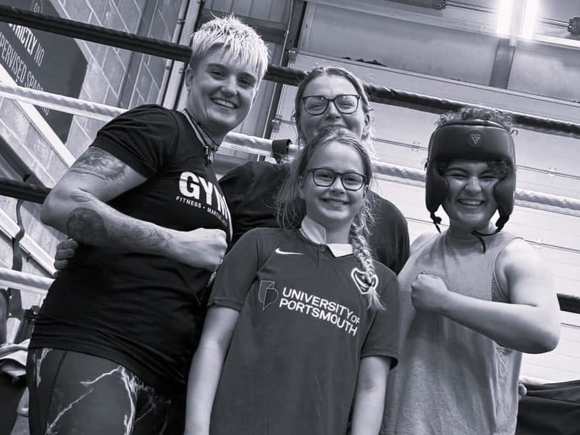 Laura Keane with three young Brave Martial Arts students at the gym